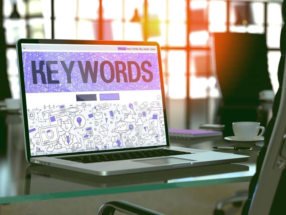 Keywords - Closeup Landing Page in Doodle Design Style on Laptop Screen. On Background of Comfortable Working Place in Modern Office. Toned, Blurred Image. 3D Render.-1