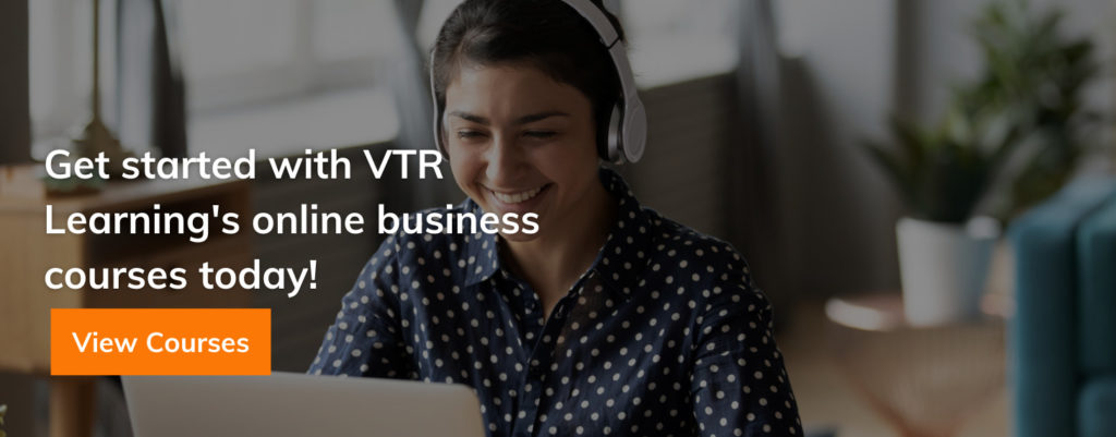 Smiling woman with headphones, looking at a computer screen, overlaid with text about VTR Learning's online business courses